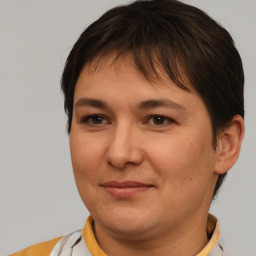 Joyful white adult female with short  brown hair and brown eyes