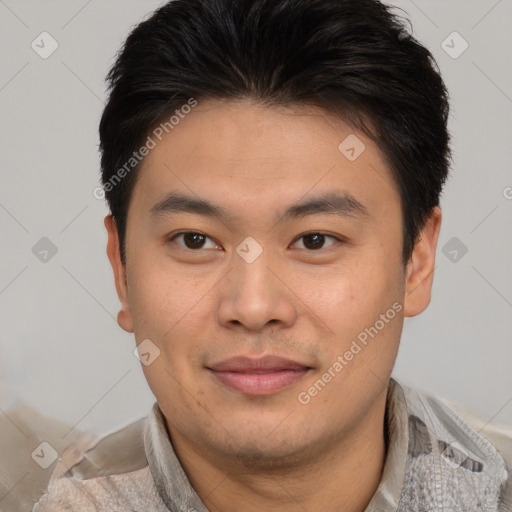 Joyful asian young-adult male with short  brown hair and brown eyes