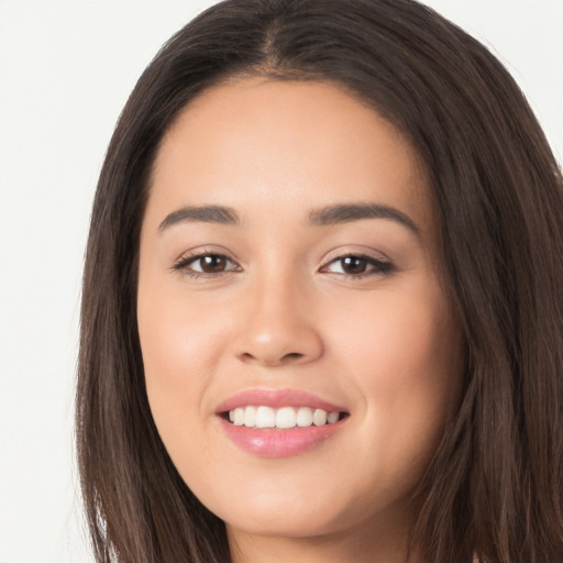 Joyful white young-adult female with long  brown hair and brown eyes