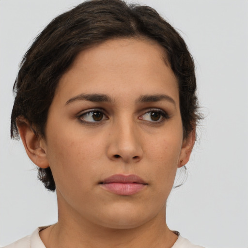 Neutral white young-adult female with short  brown hair and brown eyes