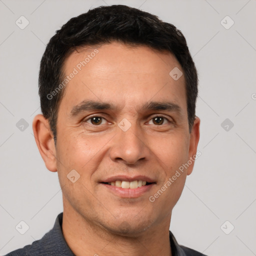 Joyful white adult male with short  black hair and brown eyes