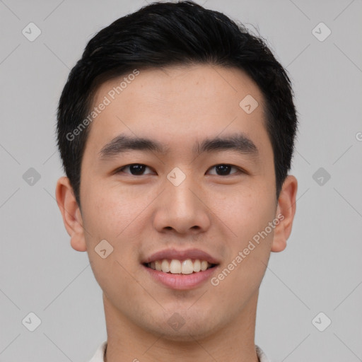 Joyful asian young-adult male with short  black hair and brown eyes