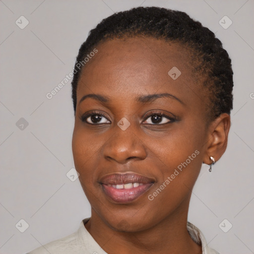 Joyful black young-adult female with short  brown hair and brown eyes