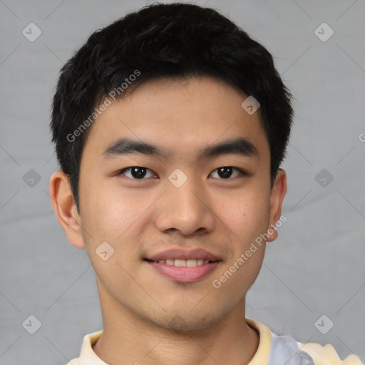 Joyful asian young-adult male with short  black hair and brown eyes