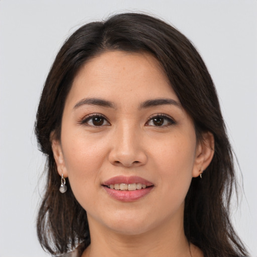 Joyful white young-adult female with medium  brown hair and brown eyes