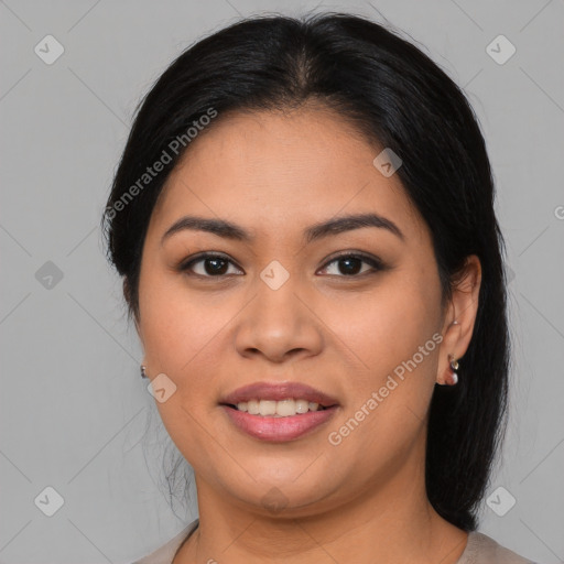 Joyful latino young-adult female with medium  brown hair and brown eyes