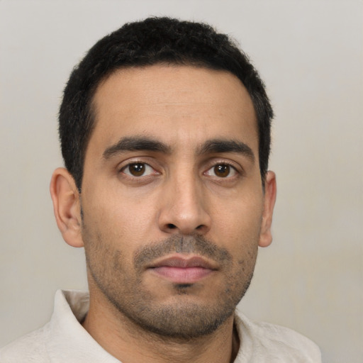 Neutral latino young-adult male with short  brown hair and brown eyes