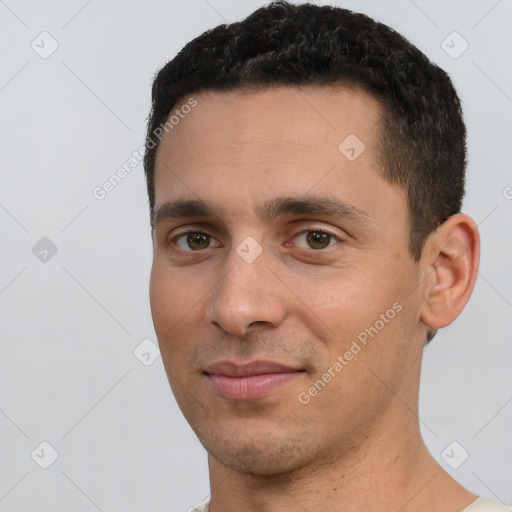 Joyful white young-adult male with short  black hair and brown eyes