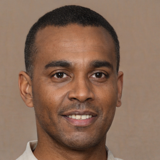 Neutral black young-adult male with short  brown hair and brown eyes