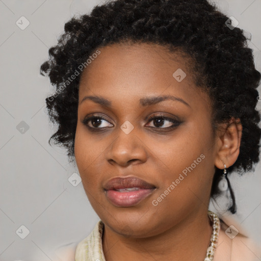 Joyful black young-adult female with long  black hair and brown eyes