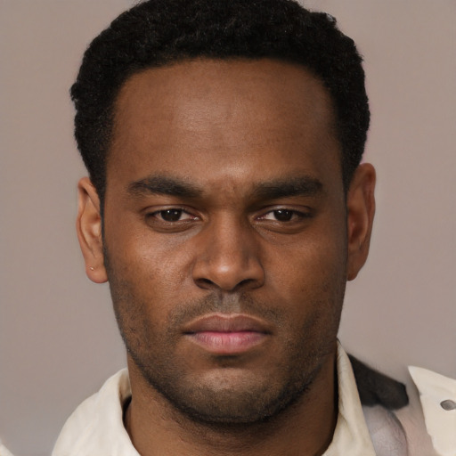 Neutral black young-adult male with short  black hair and brown eyes