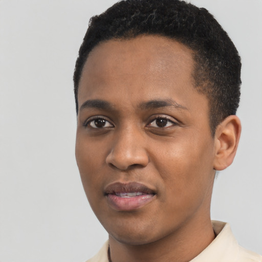 Joyful black young-adult male with short  black hair and brown eyes