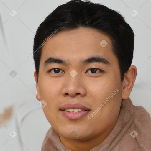 Joyful asian young-adult male with short  black hair and brown eyes