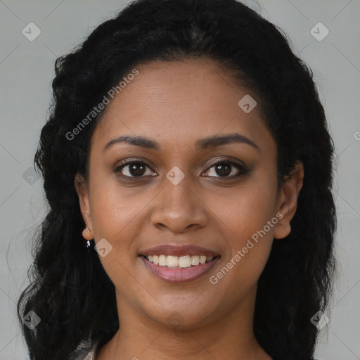 Joyful black young-adult female with long  brown hair and brown eyes