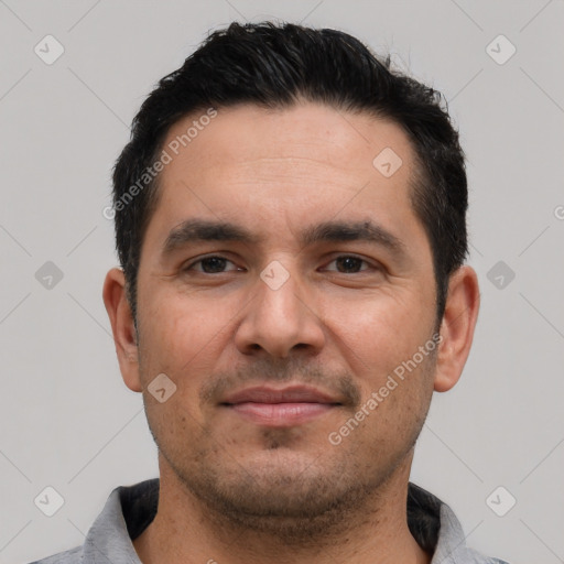 Joyful white young-adult male with short  black hair and brown eyes