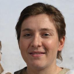 Joyful white young-adult male with medium  brown hair and brown eyes