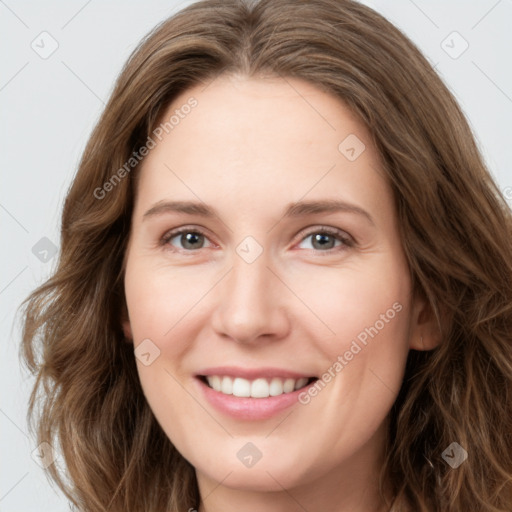 Joyful white young-adult female with long  brown hair and green eyes