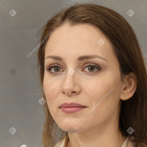 Joyful white adult female with medium  brown hair and brown eyes