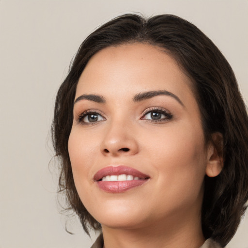 Joyful white young-adult female with medium  brown hair and brown eyes