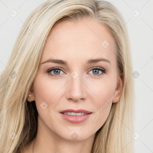 Joyful white young-adult female with long  brown hair and blue eyes