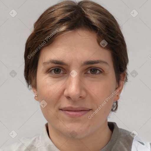 Joyful white adult female with short  brown hair and grey eyes