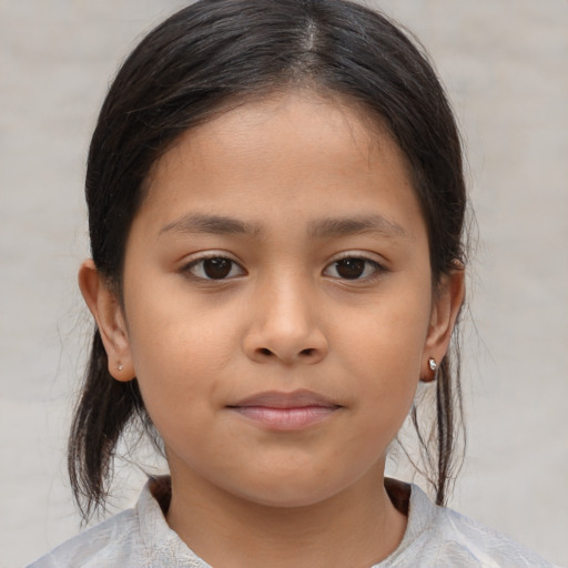Joyful asian child female with medium  brown hair and brown eyes