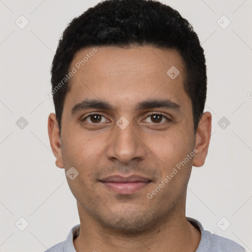 Joyful latino young-adult male with short  black hair and brown eyes