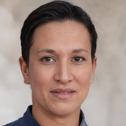 Joyful white adult female with short  brown hair and brown eyes