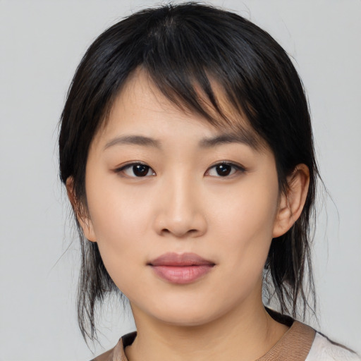 Neutral asian young-adult female with medium  black hair and brown eyes