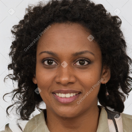 Joyful black young-adult female with medium  brown hair and brown eyes