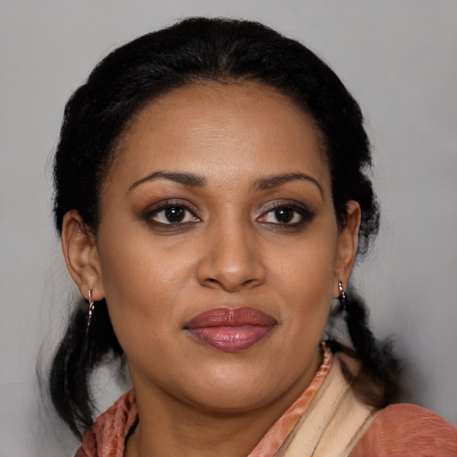 Joyful black young-adult female with medium  brown hair and brown eyes