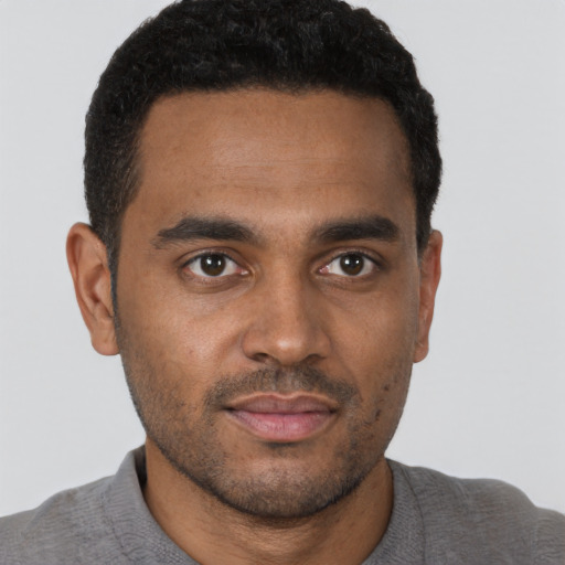 Neutral black young-adult male with short  black hair and brown eyes