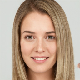 Joyful white young-adult female with long  brown hair and green eyes