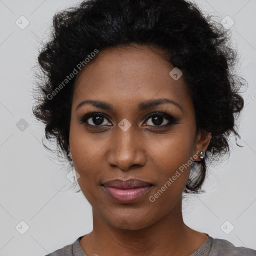 Joyful black young-adult female with medium  black hair and brown eyes