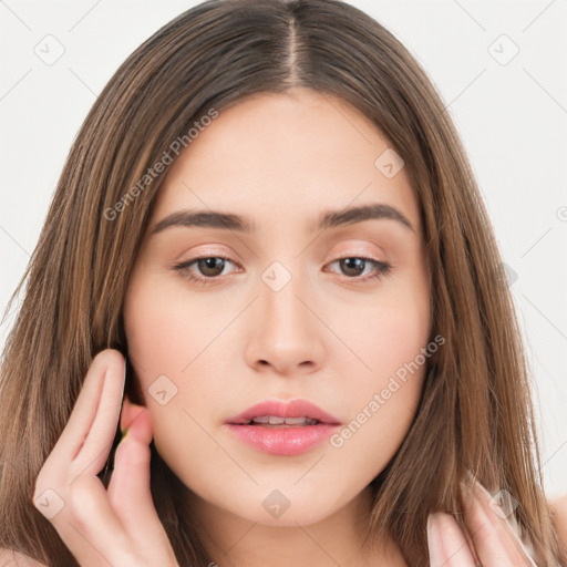 Neutral white young-adult female with long  brown hair and brown eyes