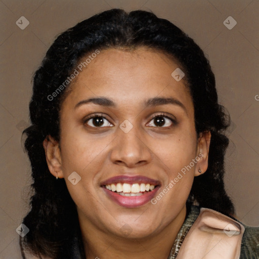 Joyful black young-adult female with long  brown hair and brown eyes