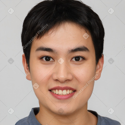 Joyful asian young-adult male with short  black hair and brown eyes