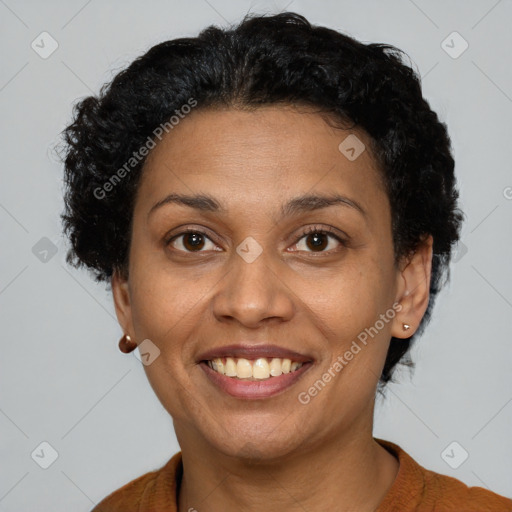 Joyful black adult female with short  brown hair and brown eyes