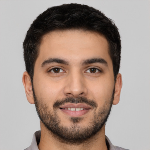 Neutral latino young-adult male with short  black hair and brown eyes