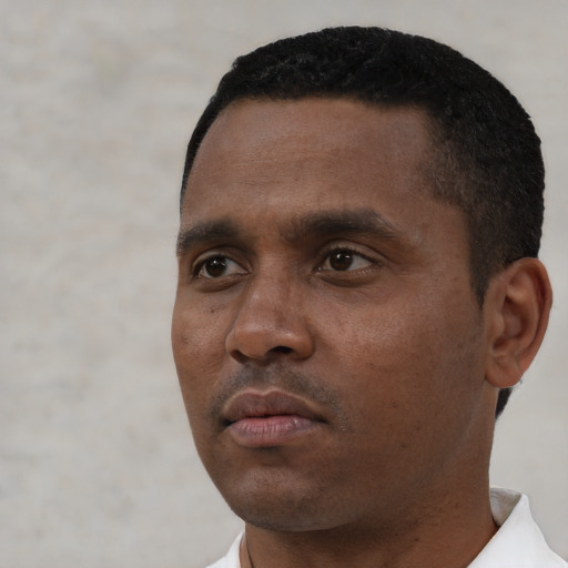 Neutral black young-adult male with short  black hair and brown eyes