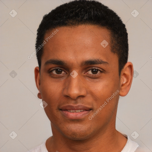 Joyful black young-adult male with short  black hair and brown eyes