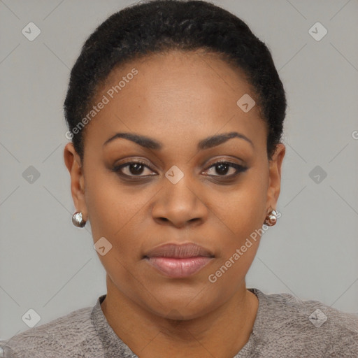 Joyful black young-adult female with short  black hair and brown eyes