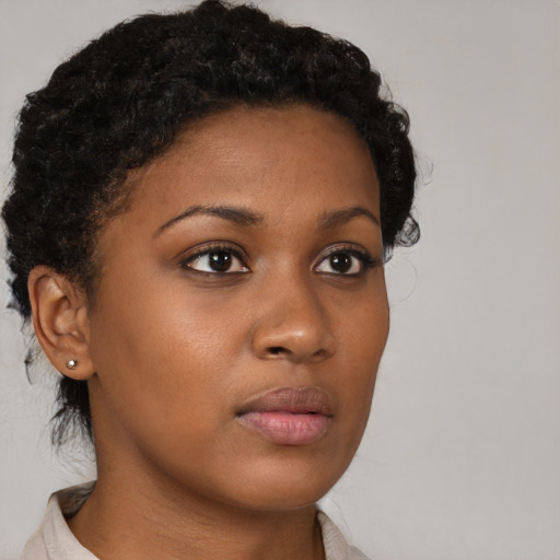Neutral black young-adult female with short  brown hair and brown eyes