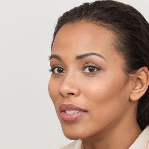 Joyful latino young-adult female with short  brown hair and brown eyes