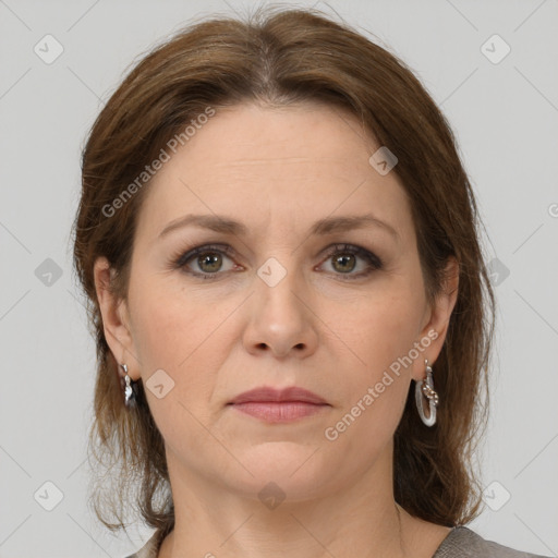 Joyful white adult female with medium  brown hair and grey eyes