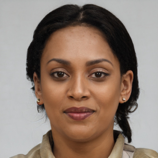 Joyful latino young-adult female with medium  black hair and brown eyes