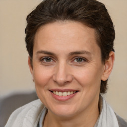 Joyful white adult female with short  brown hair and brown eyes