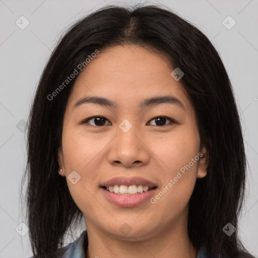 Joyful asian young-adult female with long  brown hair and brown eyes