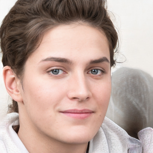 Joyful white young-adult female with medium  brown hair and blue eyes