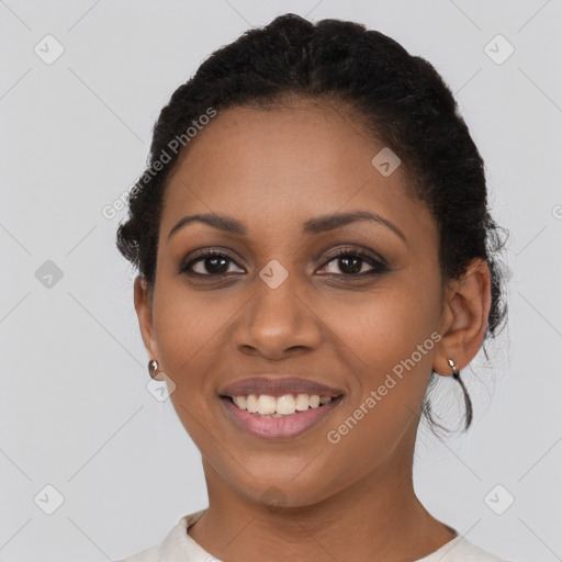 Joyful black young-adult female with short  brown hair and brown eyes